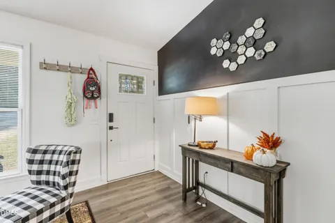 a view of hall way with furniture