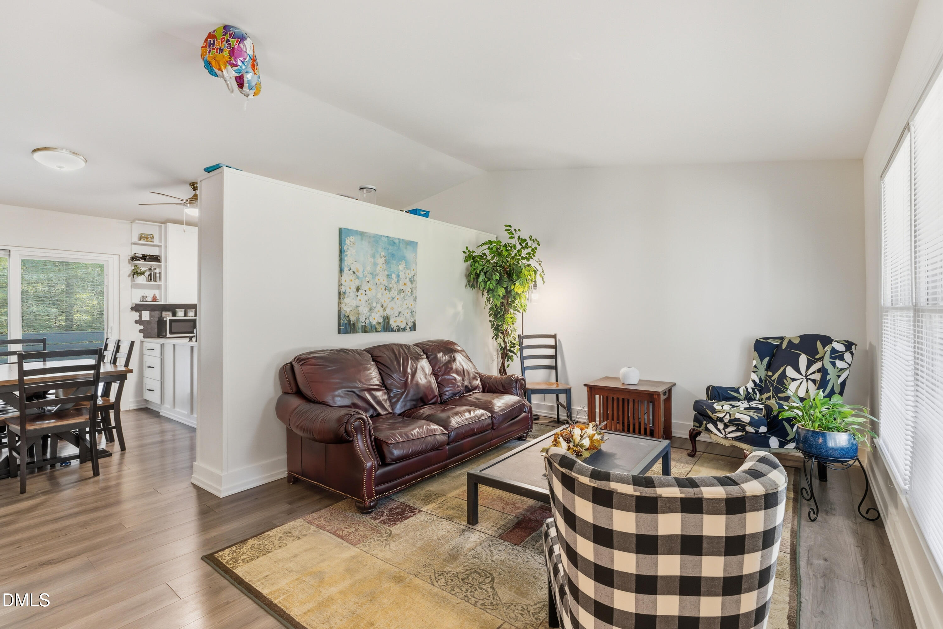 6125 Bellow Street Raleigh, NC 27609 - Photo 8 of 41 a living room with furniture and a potted plant