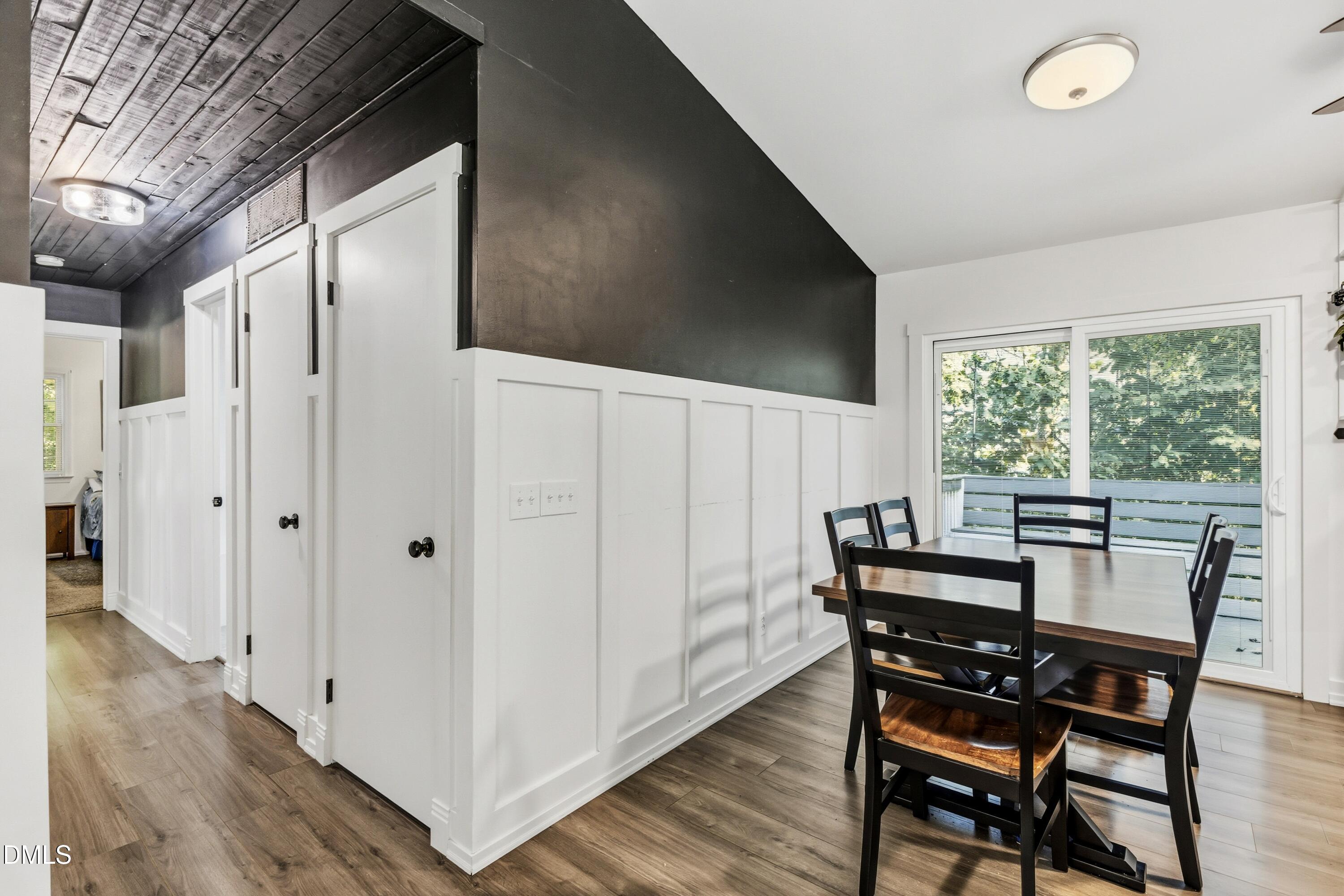 6125 Bellow Street Raleigh, NC 27609 - Photo 9 of 41 a view of a dining room with furniture window and wooden floor