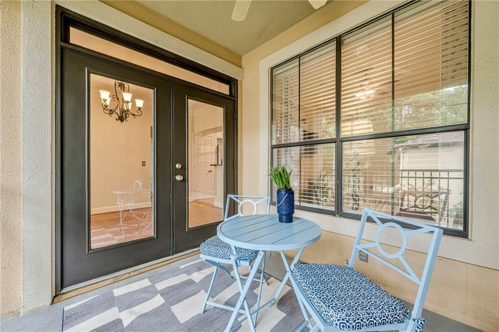 3777 Peachtree Road Northeast, Unit 1632 Brookhaven, GA 30319 - Photo 15 of 43 a view of a dining room with furniture window and wooden floor