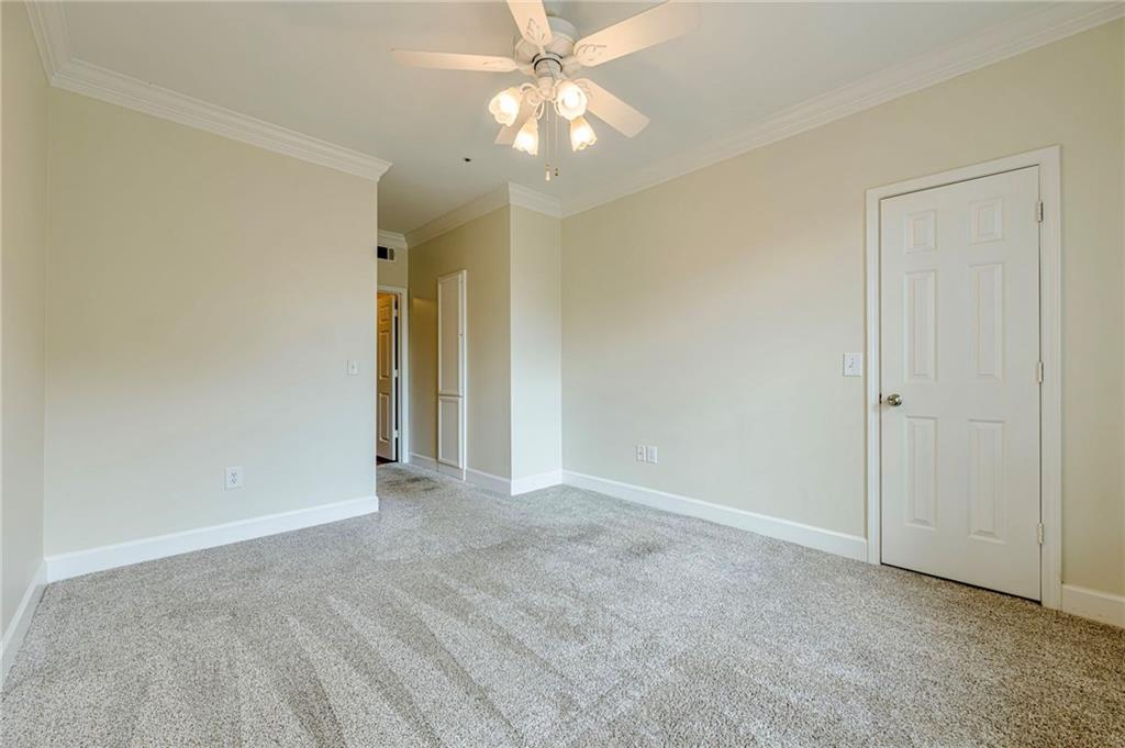 3777 Peachtree Road Northeast, Unit 1632 Brookhaven, GA 30319 - Photo 19 of 43 a view of an empty room and chandelier fan