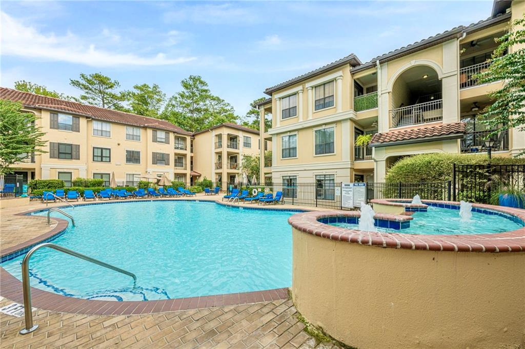 3777 Peachtree Road Northeast, Unit 1632 Brookhaven, GA 30319 - Photo 25 of 43 a front view of a house with garden