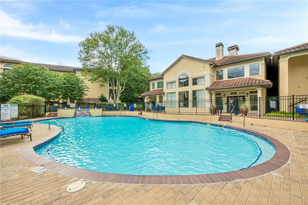 3777 Peachtree Road Northeast, Unit 1632 Brookhaven, GA 30319 - Photo 28 of 43 a view of a house with swimming pool and sitting area