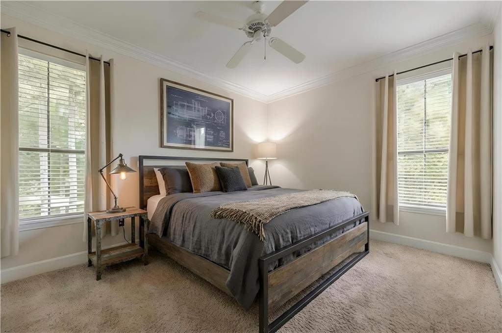 3777 Peachtree Road Northeast, Unit 1632 Brookhaven, GA 30319 - Photo 3 of 43 a spacious bedroom with a bed and a window