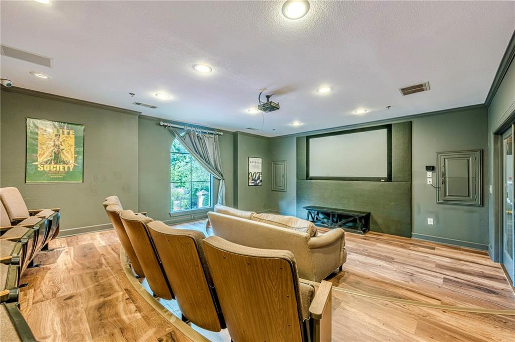 3777 Peachtree Road Northeast, Unit 1632 Brookhaven, GA 30319 - Photo 34 of 43 a living room with furniture floor to ceiling window and wooden floor
