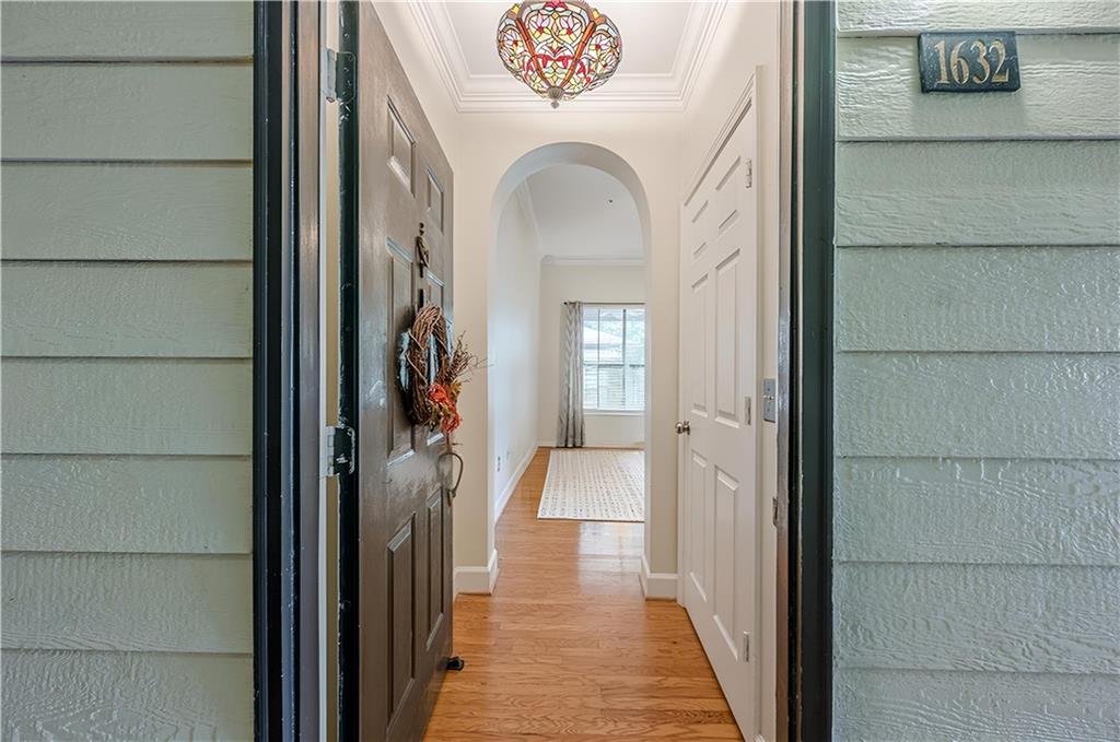 3777 Peachtree Road Northeast, Unit 1632 Brookhaven, GA 30319 - Photo 6 of 43 a view of a hallway view with wooden floor and a bathroom