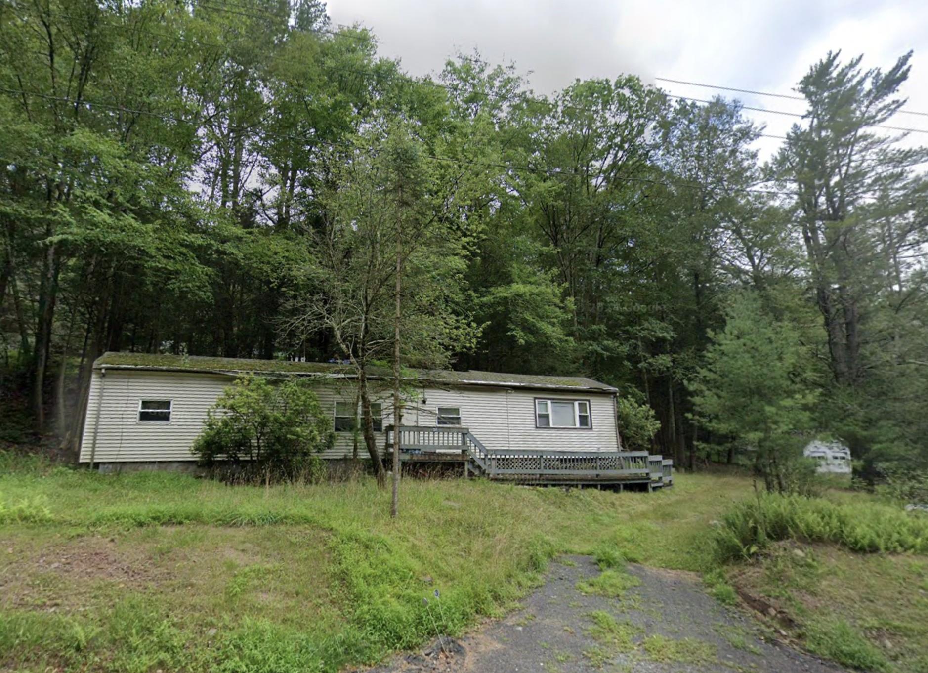 34 Highland Lake Road Eldred, NY 12732 - Photo 2 of 2 Manufactured / mobile home featuring a wooden deck