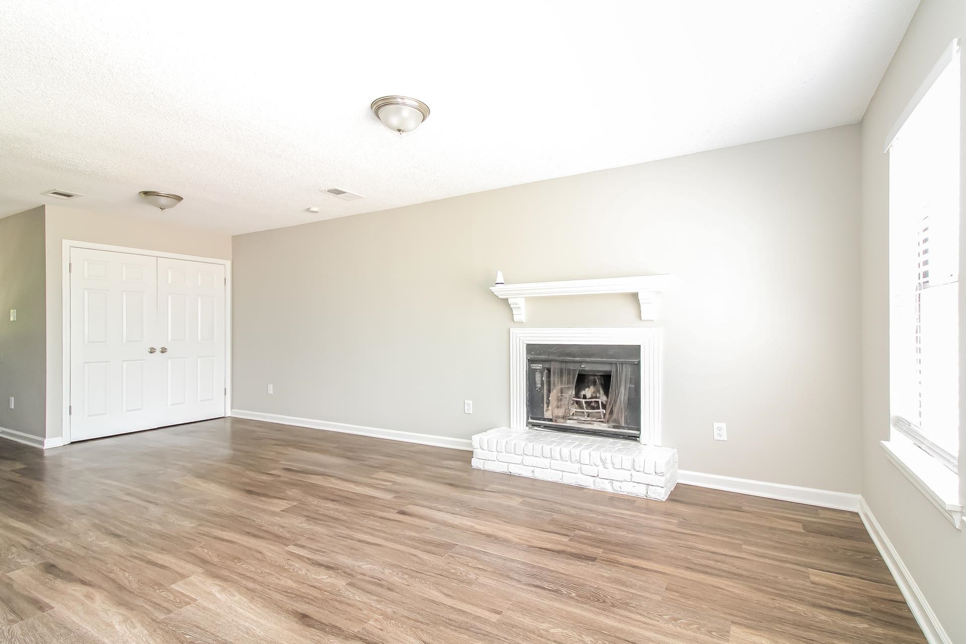 3546 Christine Road Memphis, TN 38118 - Photo 5 of 23 a view of an empty room with window and wooden floor