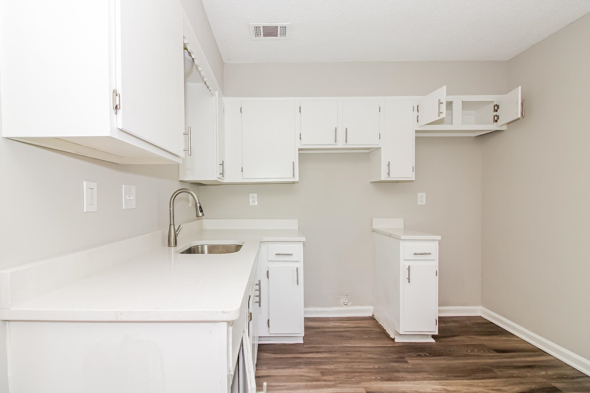 3546 Christine Road Memphis, TN 38118 - Photo 8 of 23 a kitchen with a sink cabinets and wooden floor