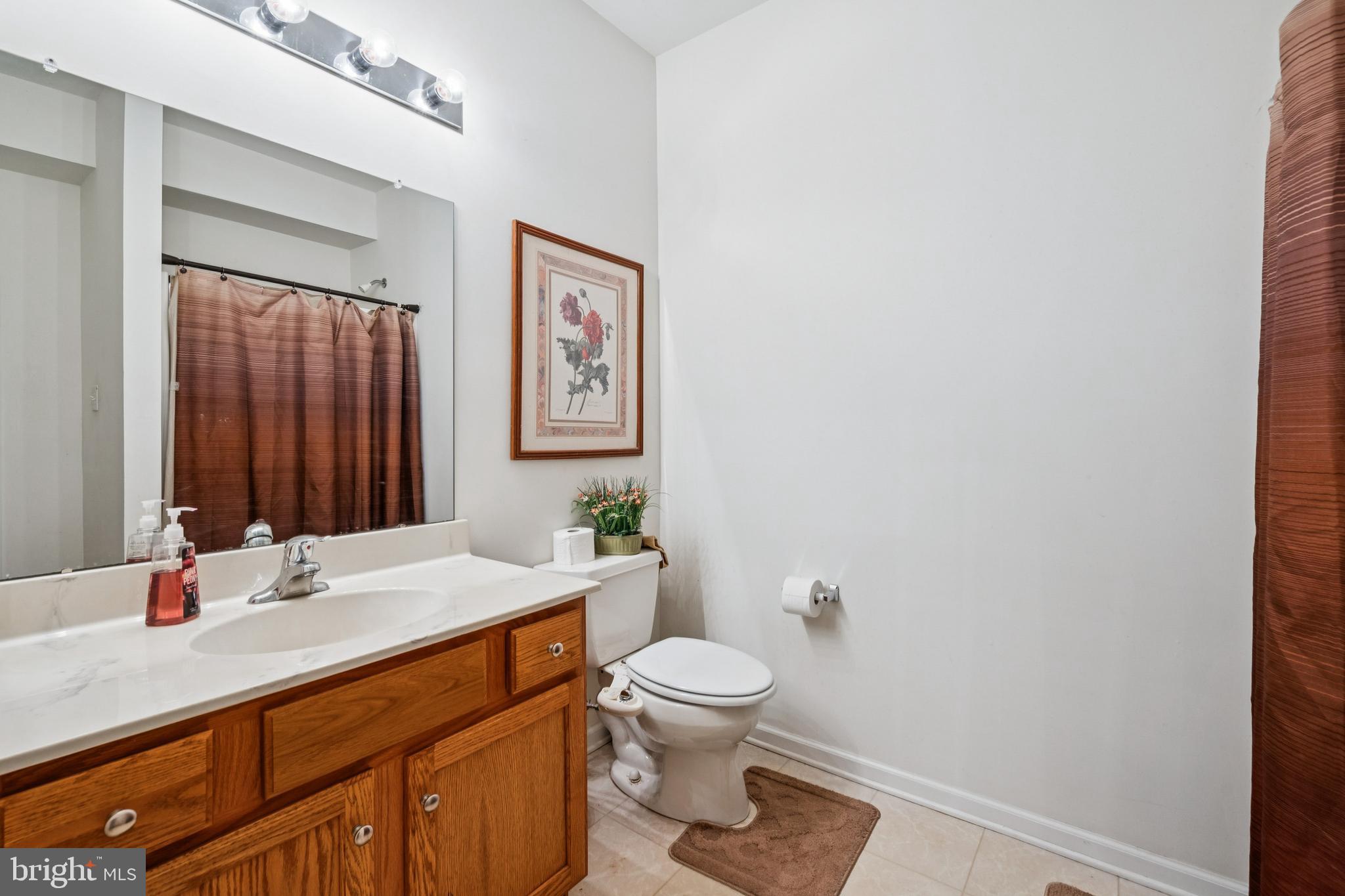 17 Jasmine Way Sewell, NJ 08080 - Photo 26 of 30 a bathroom with a sink a toilet and shower