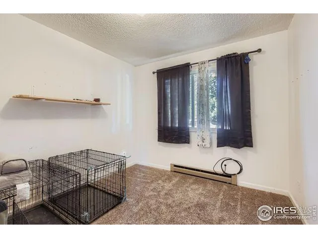 a view of a livingroom with furniture and window
