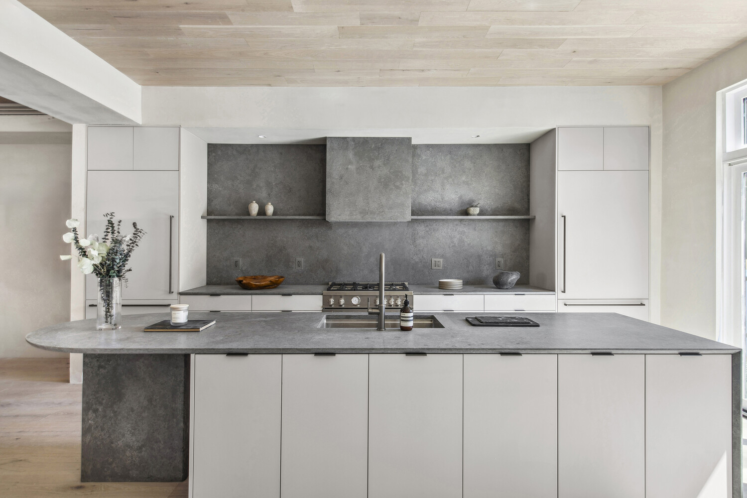 432 Fenimore Street Brooklyn, NY 11225 - Photo 4 of 25 a kitchen with kitchen island granite countertop a sink a counter space and cabinets