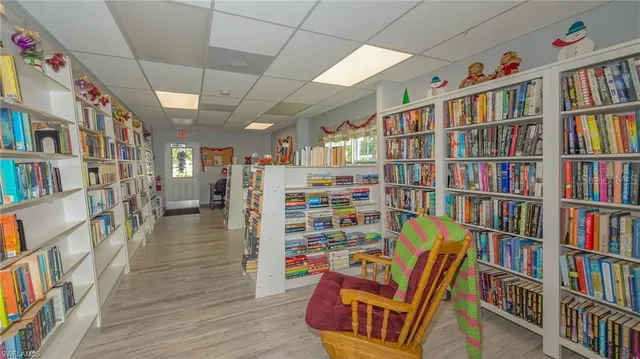 a living room with lots of books