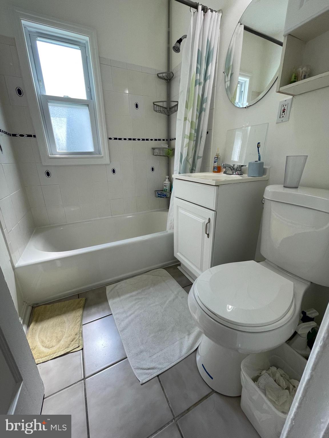 12306 Veirs Mill Road Silver Spring, MD 20906 - Photo 12 of 45 a bathroom with a toilet sink and mirror