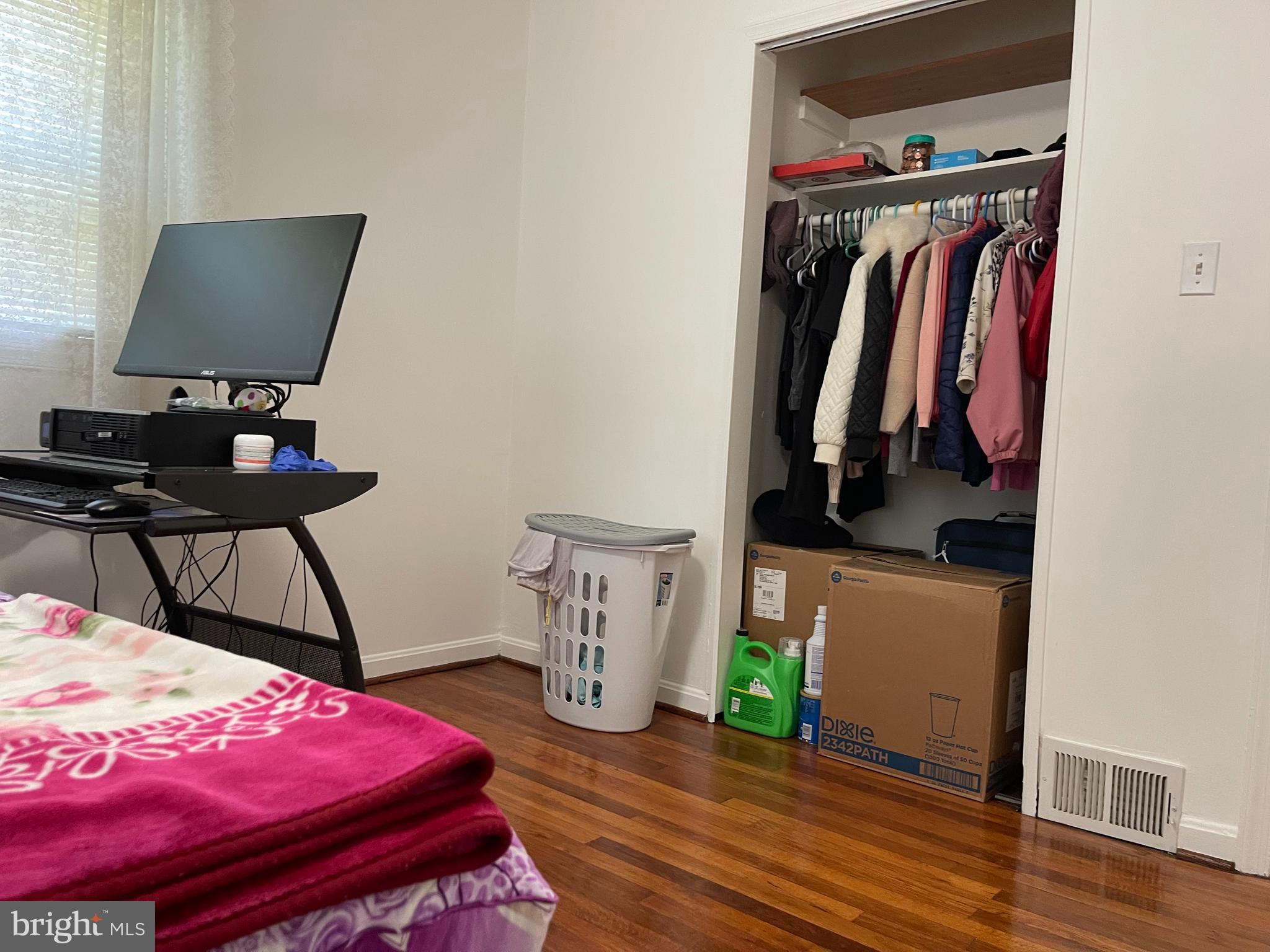 12306 Veirs Mill Road Silver Spring, MD 20906 - Photo 14 of 45 a bedroom with a bed and a potted plant