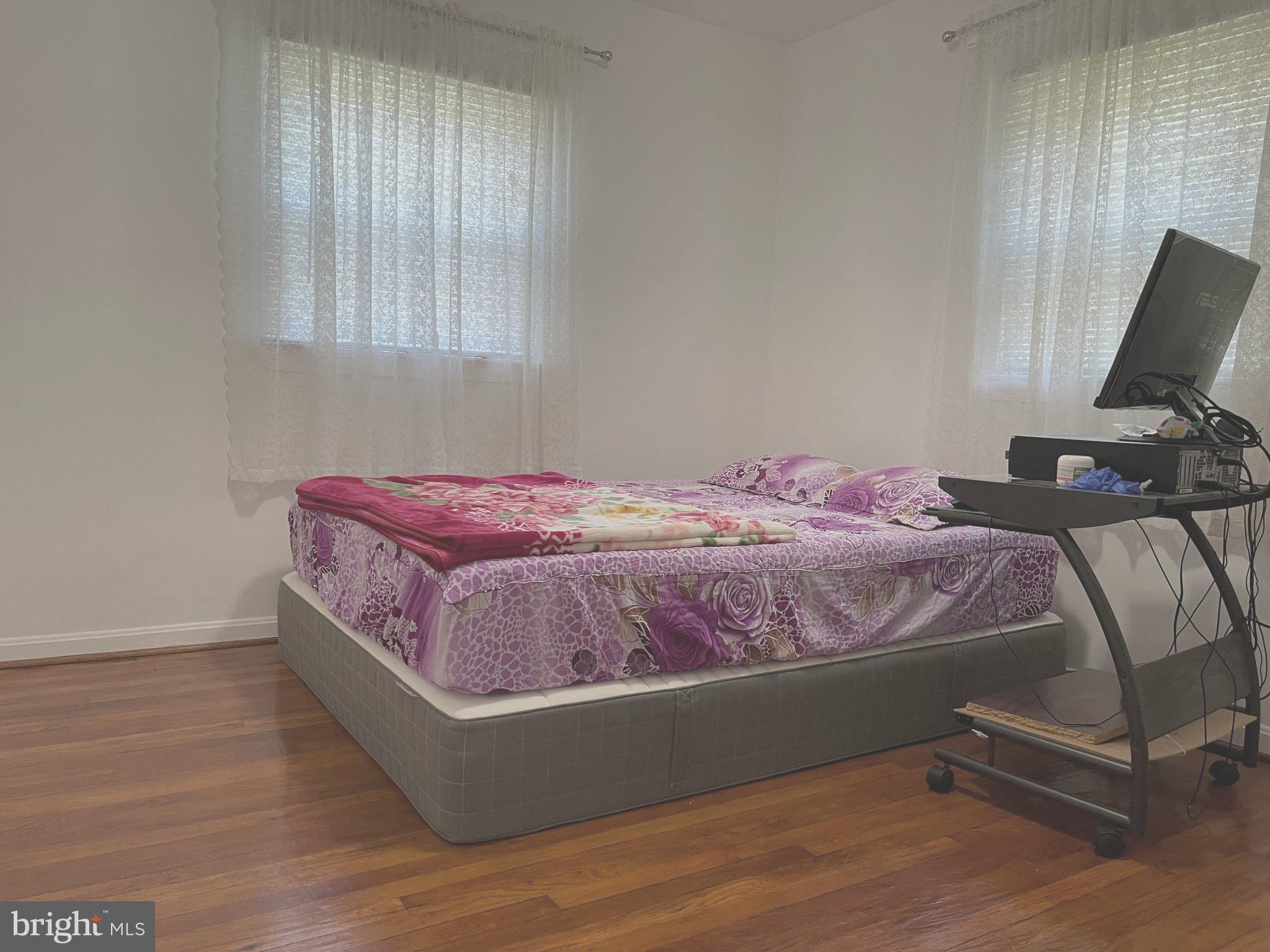 12306 Veirs Mill Road Silver Spring, MD 20906 - Photo 15 of 45 a bedroom with a bed and window