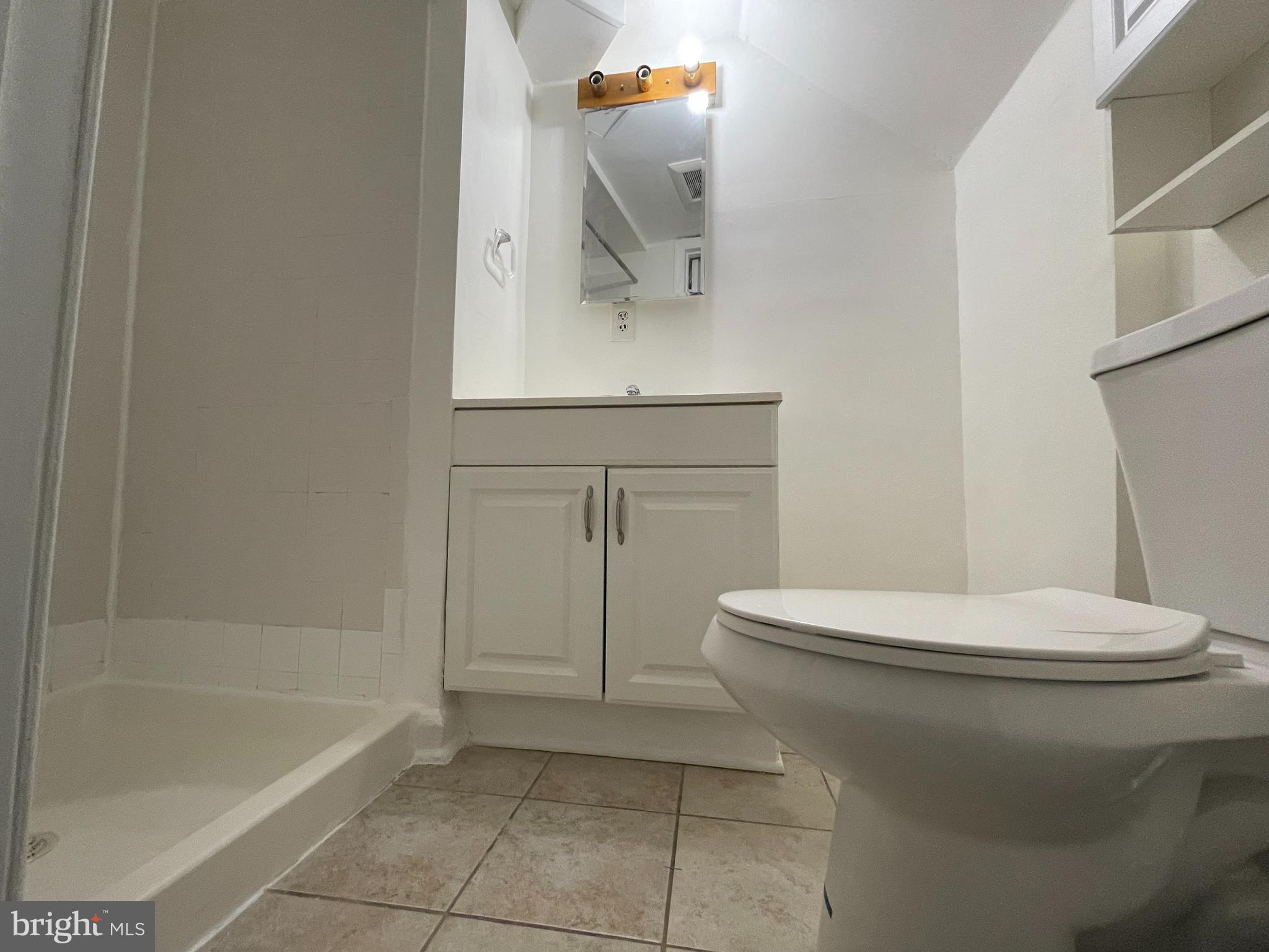 12306 Veirs Mill Road Silver Spring, MD 20906 - Photo 30 of 45 a bathroom with a toilet a sink and bathtub