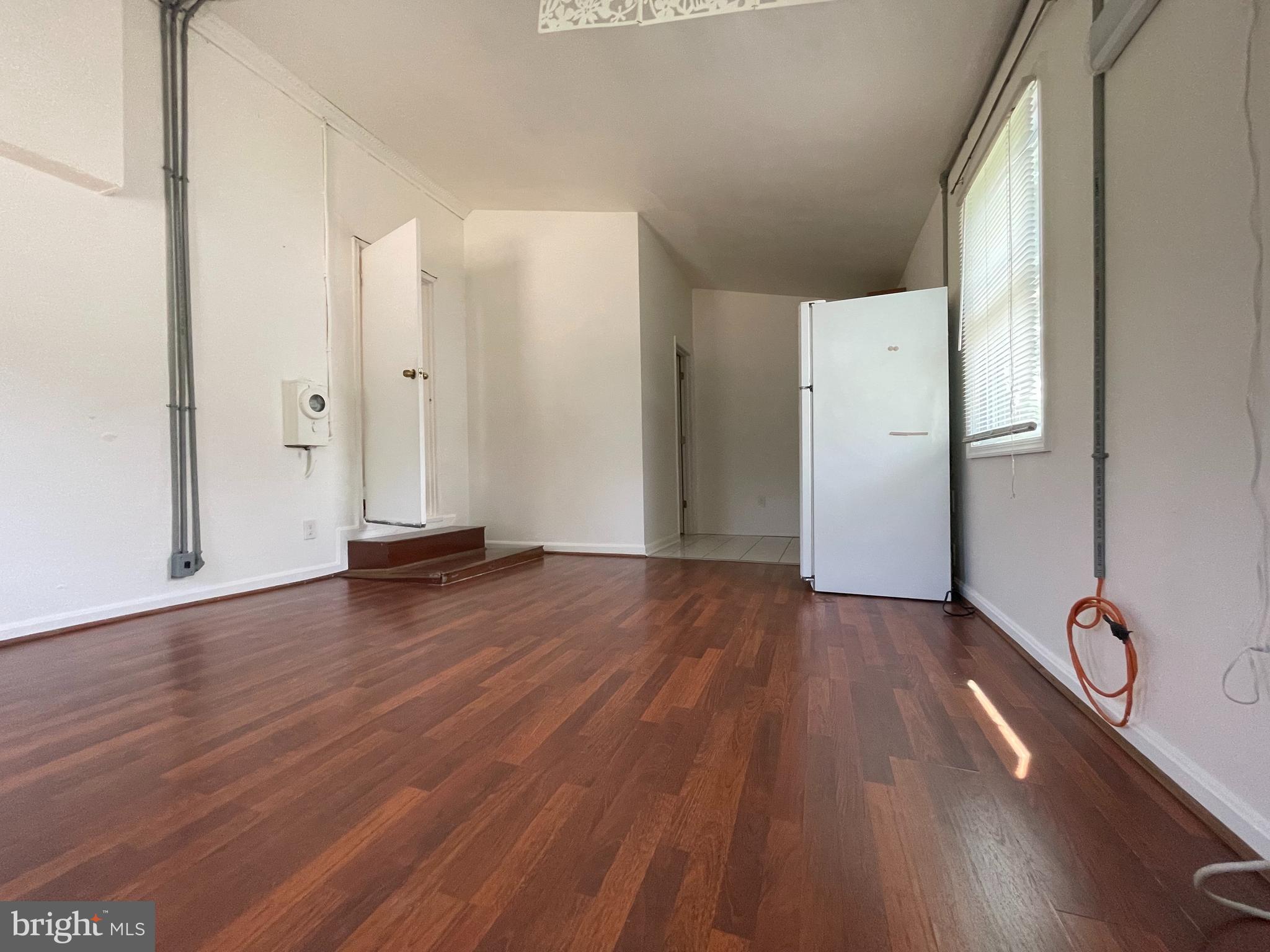 12306 Veirs Mill Road Silver Spring, MD 20906 - Photo 35 of 45 a view of empty room with wooden floor