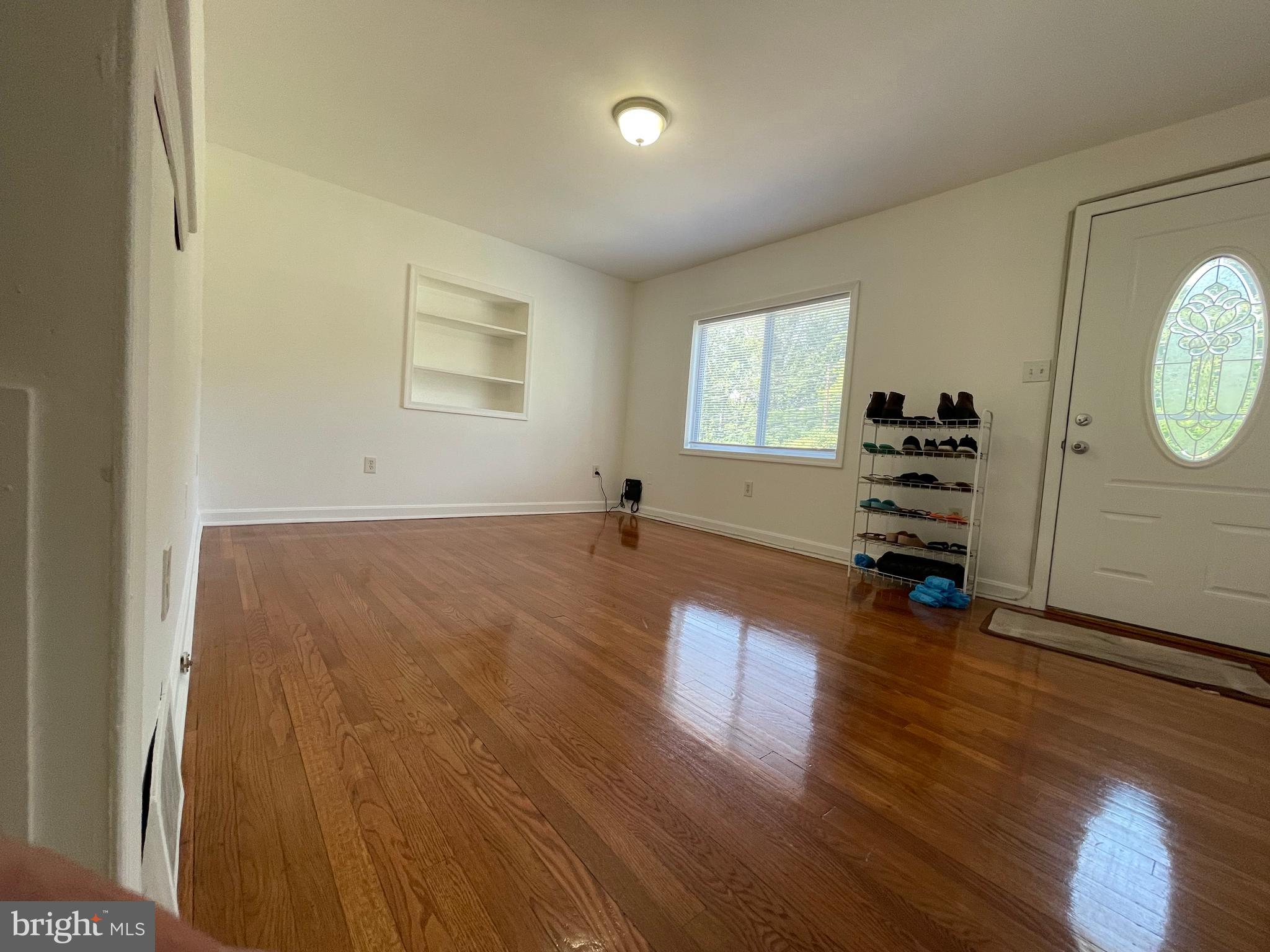 12306 Veirs Mill Road Silver Spring, MD 20906 - Photo 9 of 45 wooden floor in an empty room with a window