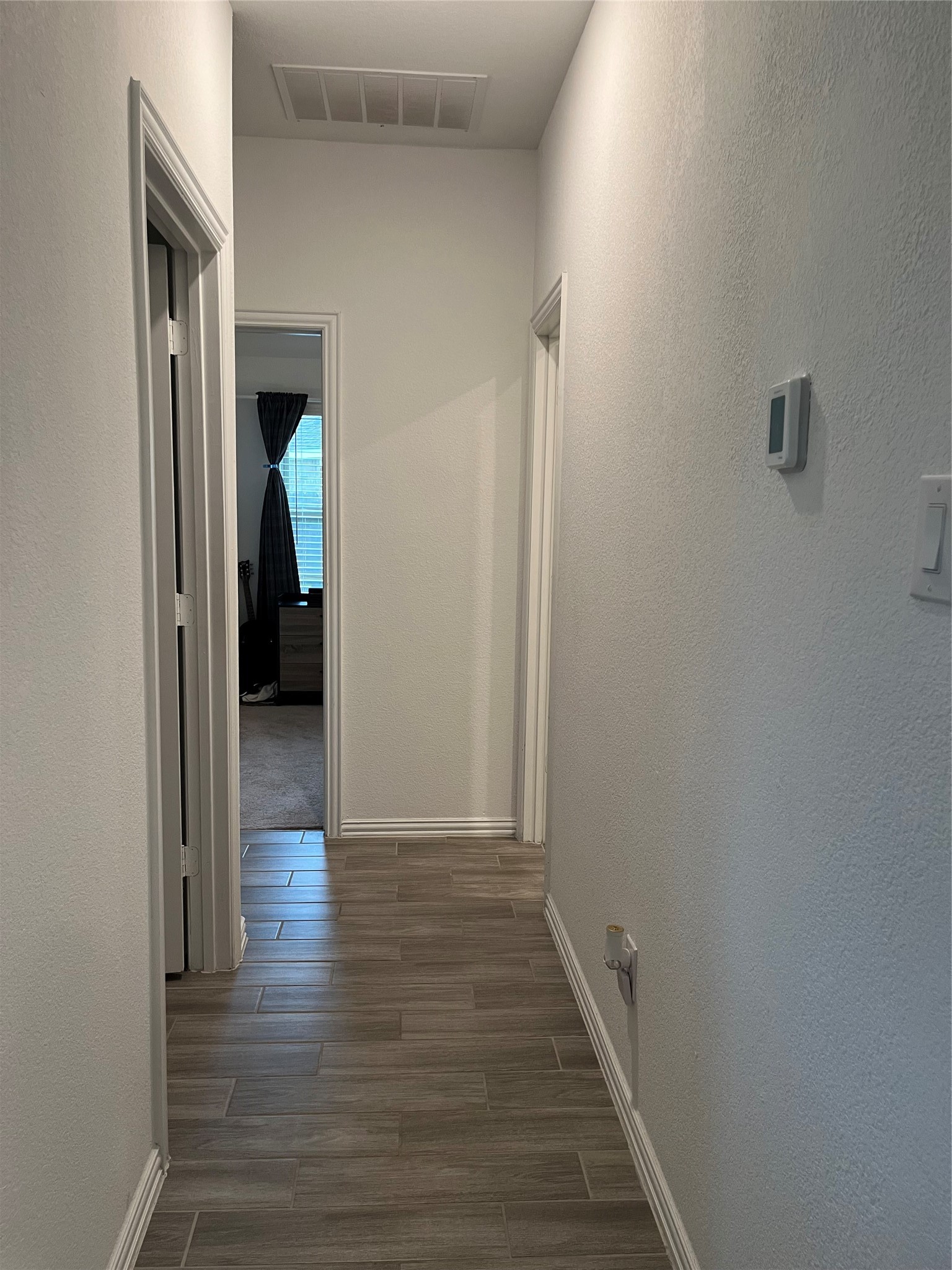 14242 Amherst Mdw Trail Rosharon, TX 77583 - Photo 14 of 36 Hall to the Laundry Room on the Left & Bathroom on the Right.