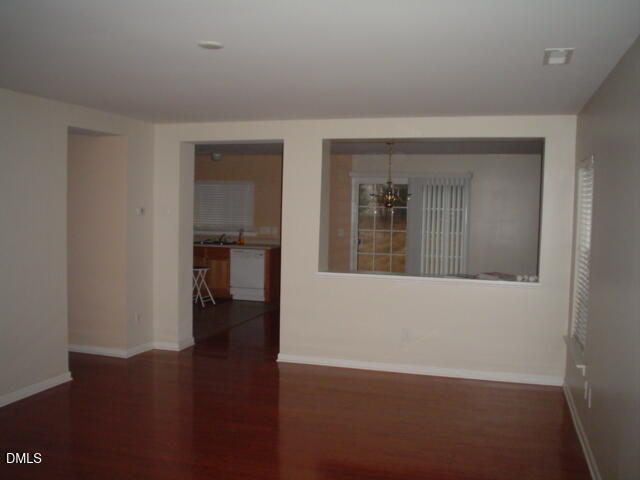 6005 Namozine Court Raleigh, NC 27610 - Photo 4 of 8 wooden floor in a hall with a window