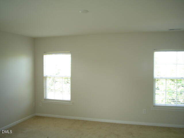 6005 Namozine Court Raleigh, NC 27610 - Photo 6 of 8 an empty room with a window