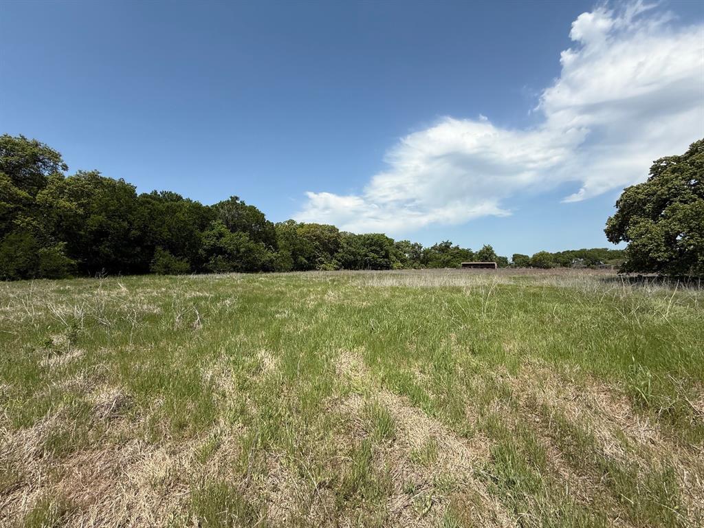 0 County Road 3940 Poolville, TX 76487 - Photo 3 of 6 a view of a lake with houses in the back