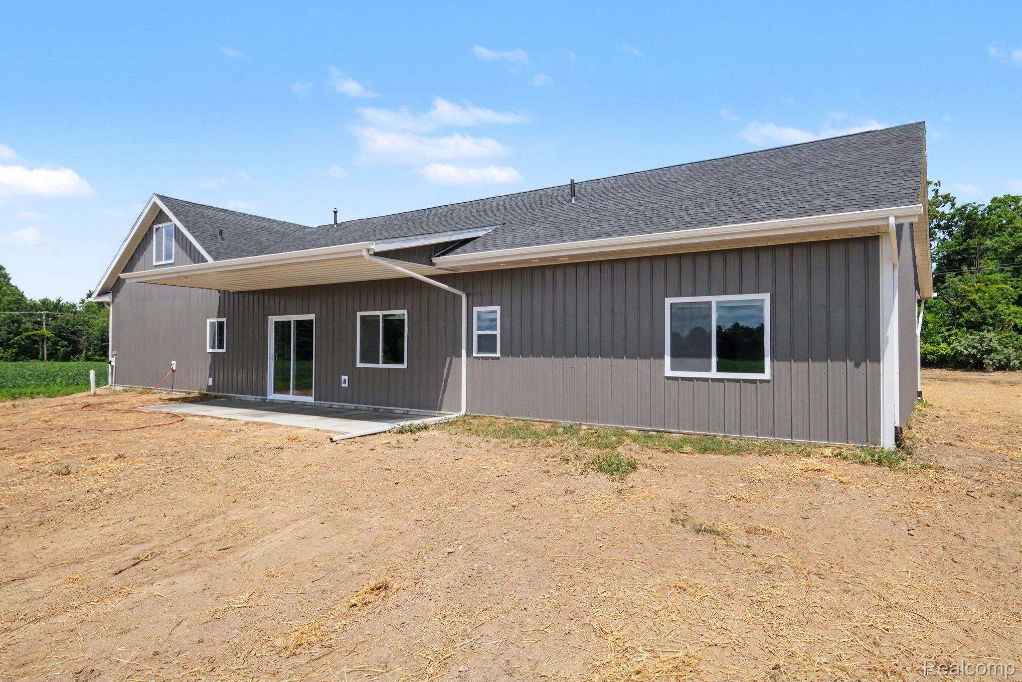 12425 Miller Road Lennon, MI 48449 - Photo 25 of 26 Contemporary siding in a neutral gray hue