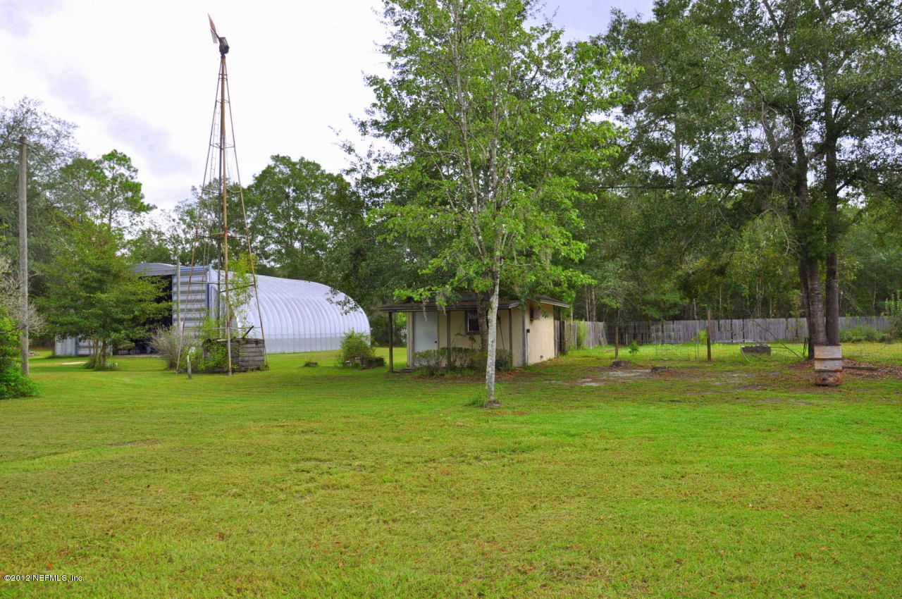 4147 Pinto Road Middleburg, FL 32068 - Photo 6 of 31 a fire hydrant in the middle of a field