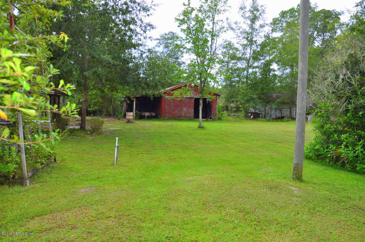 4147 Pinto Road Middleburg, FL 32068 - Photo 8 of 31 a view of a house with a backyard