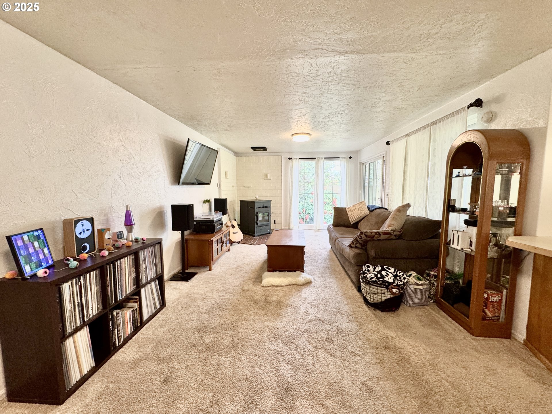 397 River Loop 2 Eugene, OR 97404 - Photo 11 of 42 a living room with furniture and a fireplace