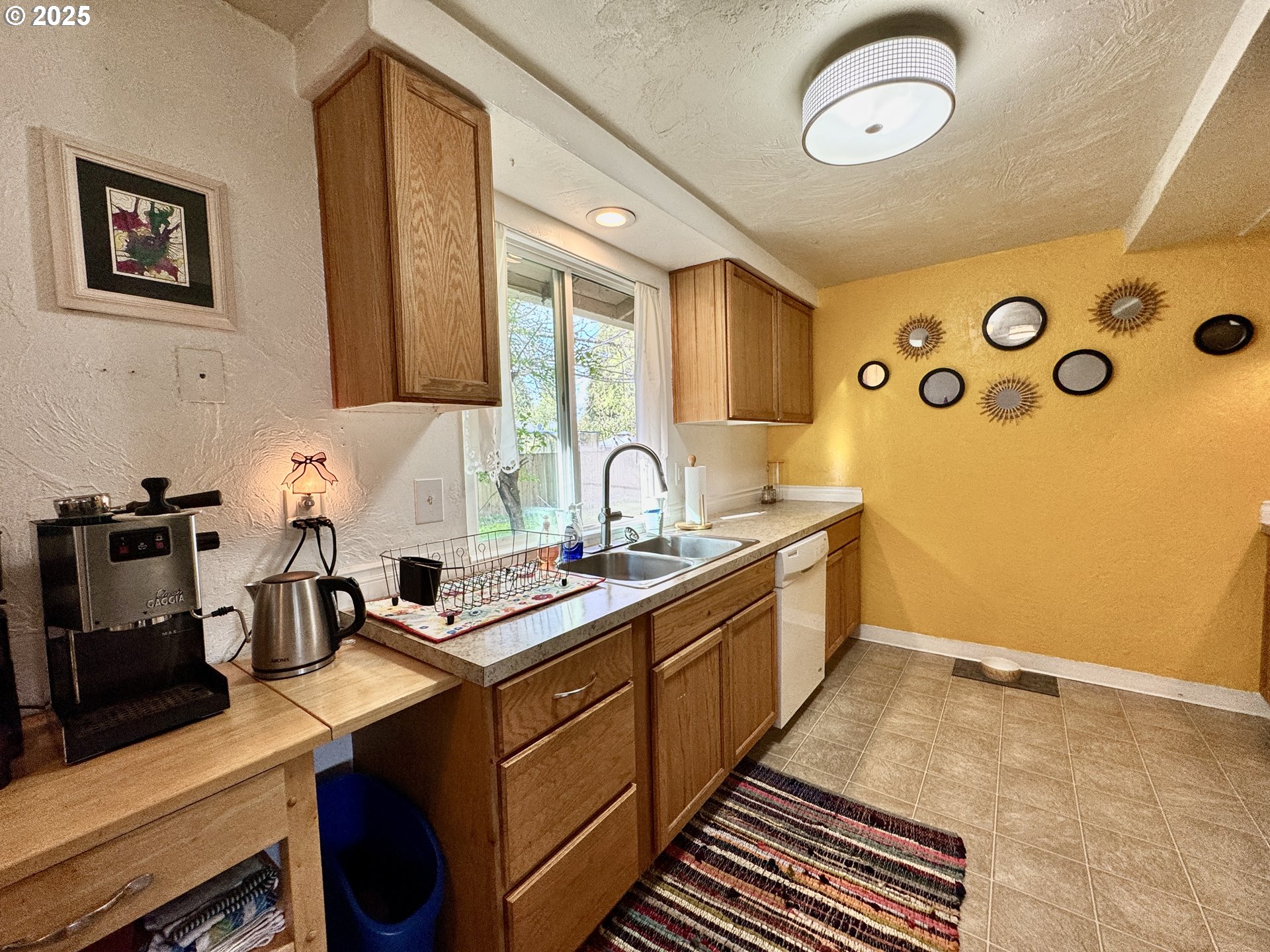 397 River Loop 2 Eugene, OR 97404 - Photo 14 of 42 a kitchen with a sink and a stove top oven