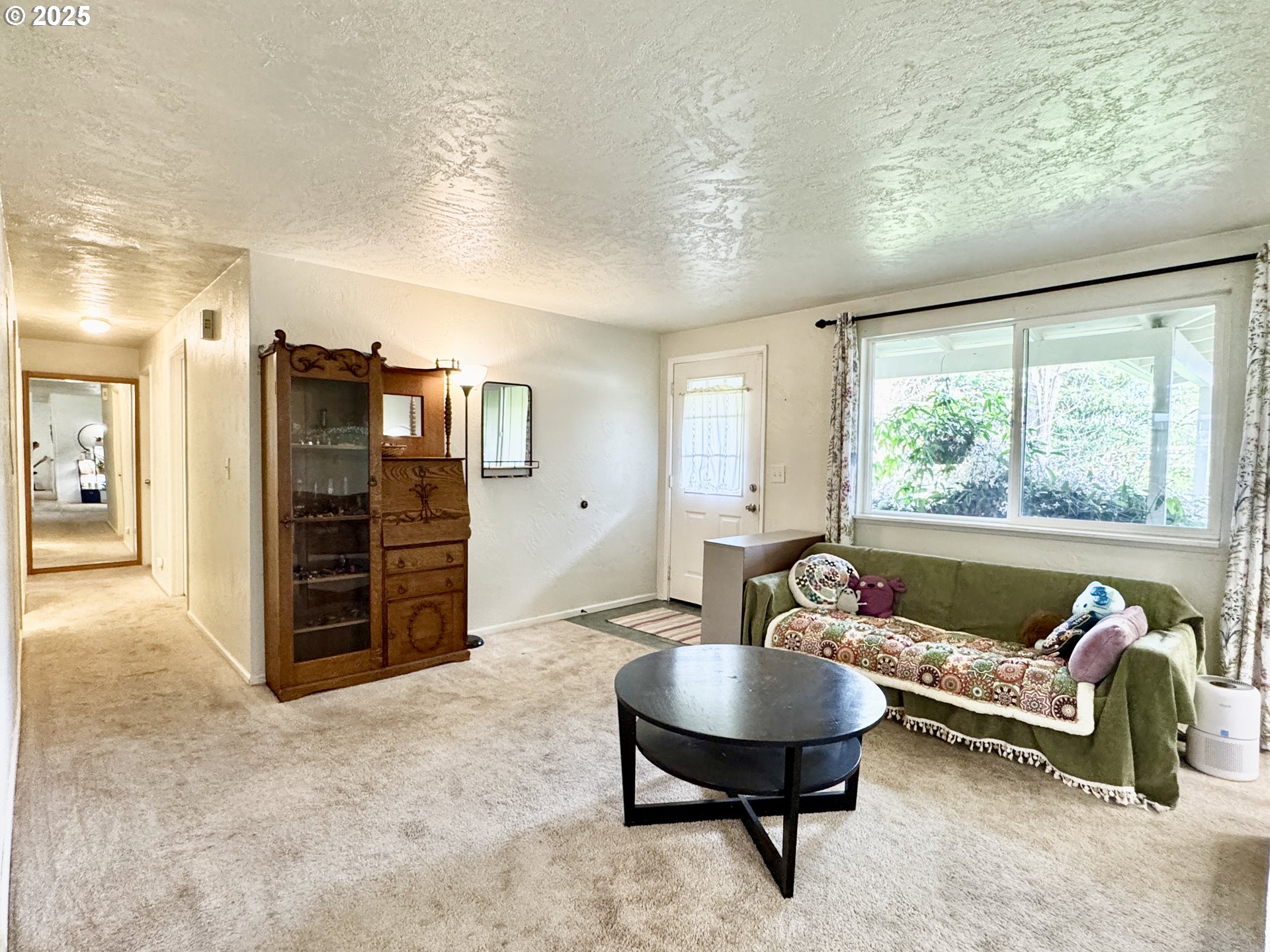 397 River Loop 2 Eugene, OR 97404 - Photo 18 of 42 a living room with furniture and a window
