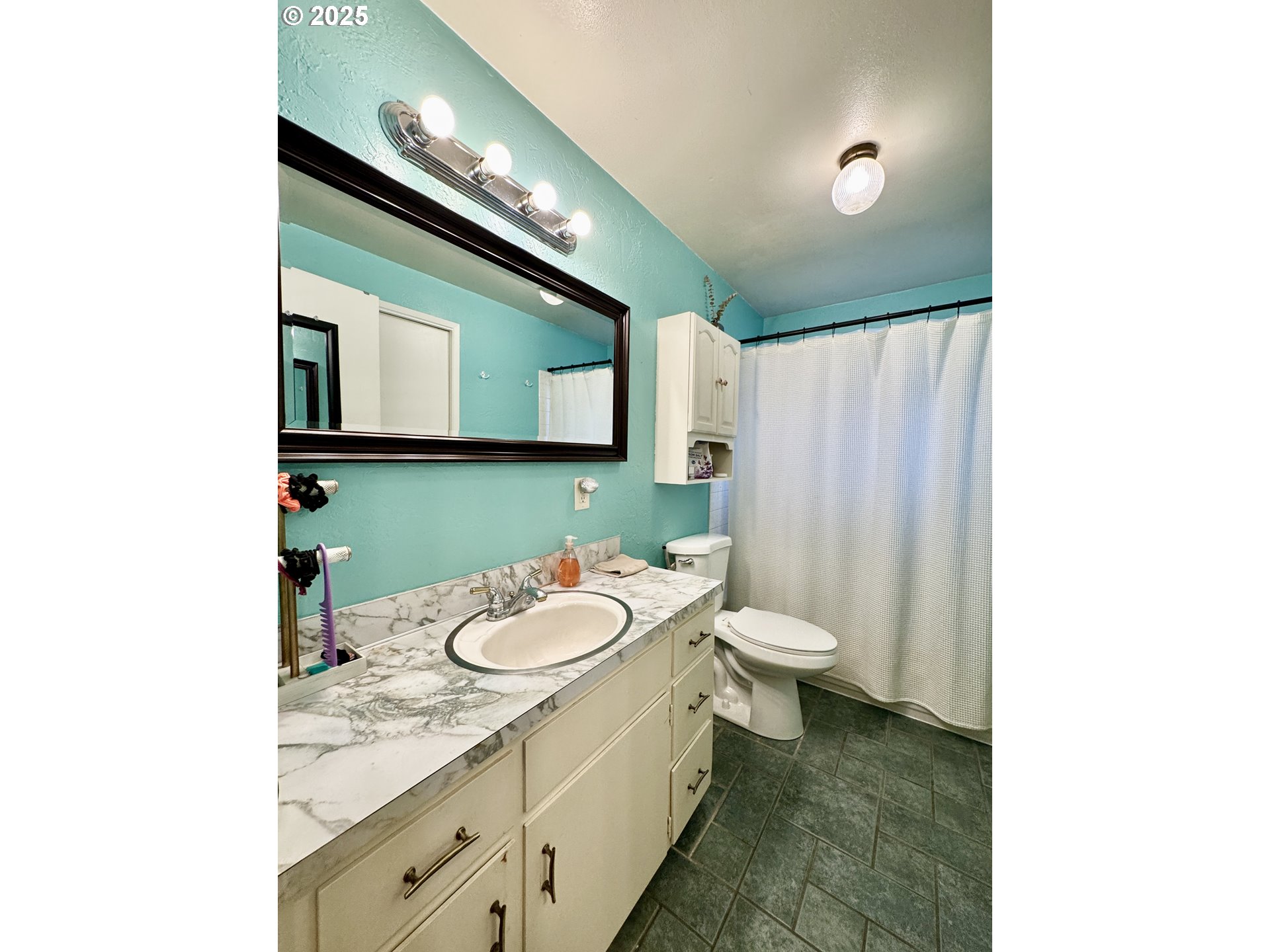 397 River Loop 2 Eugene, OR 97404 - Photo 20 of 42 a bathroom with a toilet sink and mirror