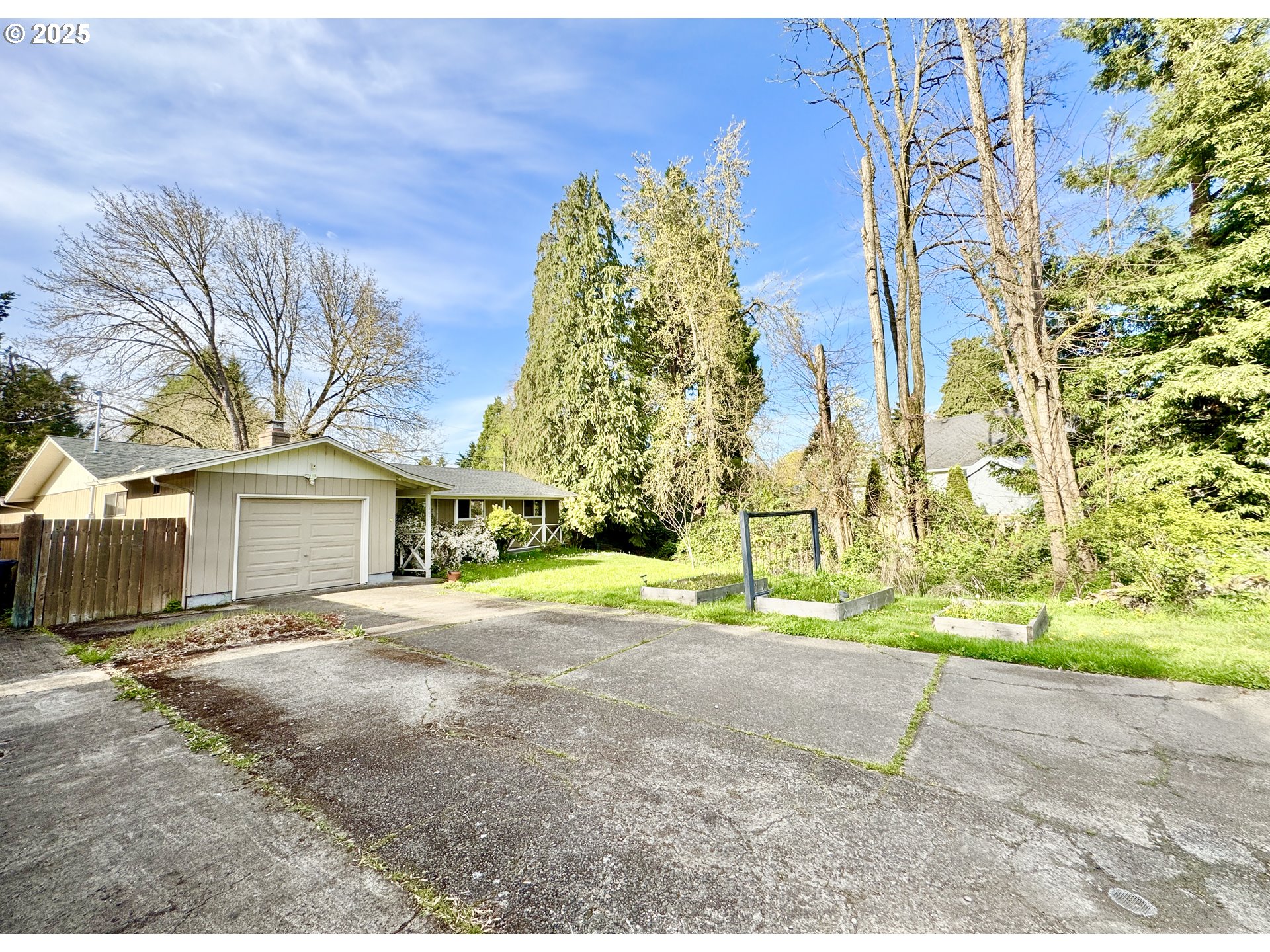 397 River Loop 2 Eugene, OR 97404 - Photo 2 of 42 front view of a house next to a yard and trees