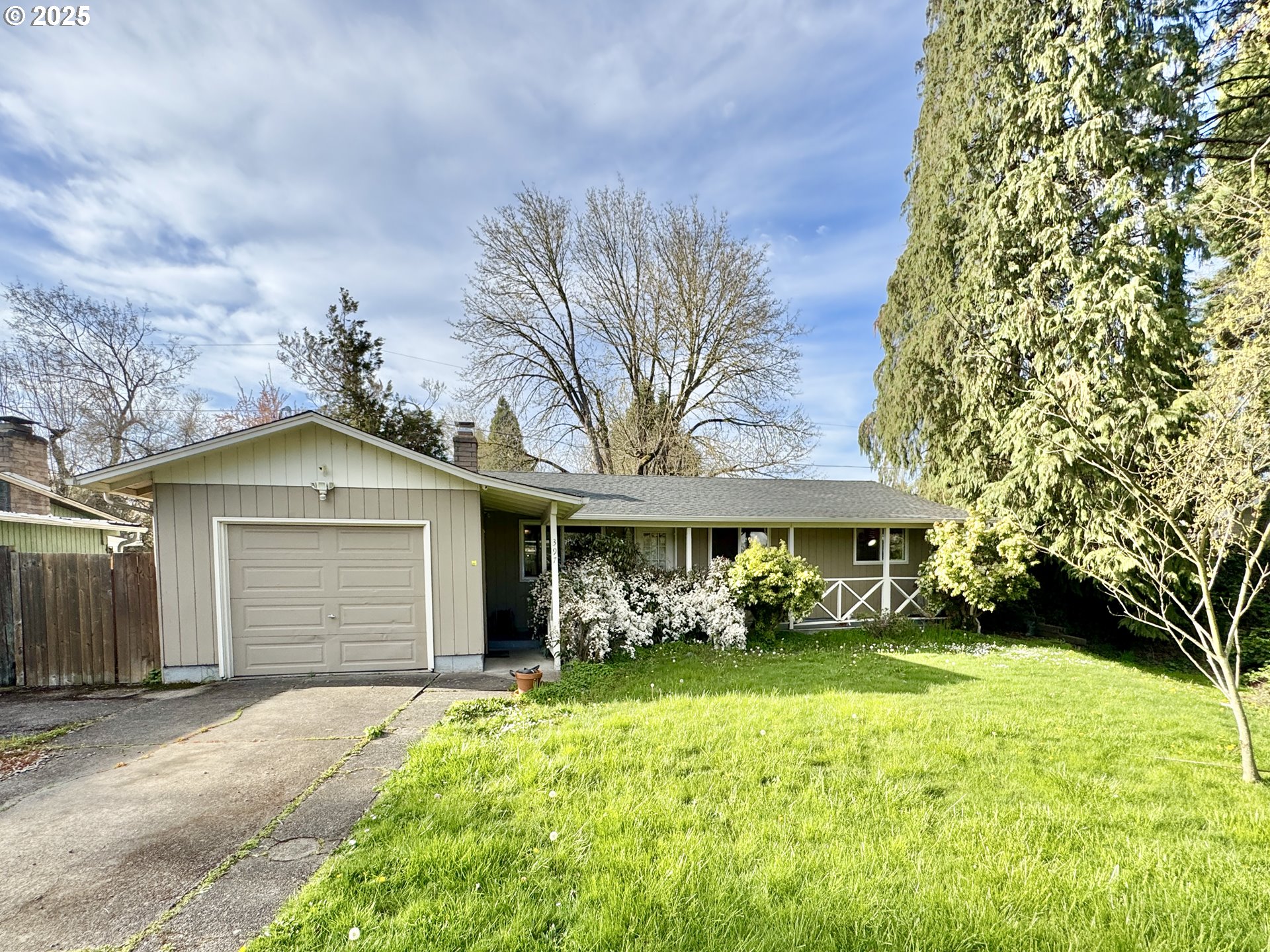 397 River Loop 2 Eugene, OR 97404 - Photo 4 of 42 a front view of a house with garden