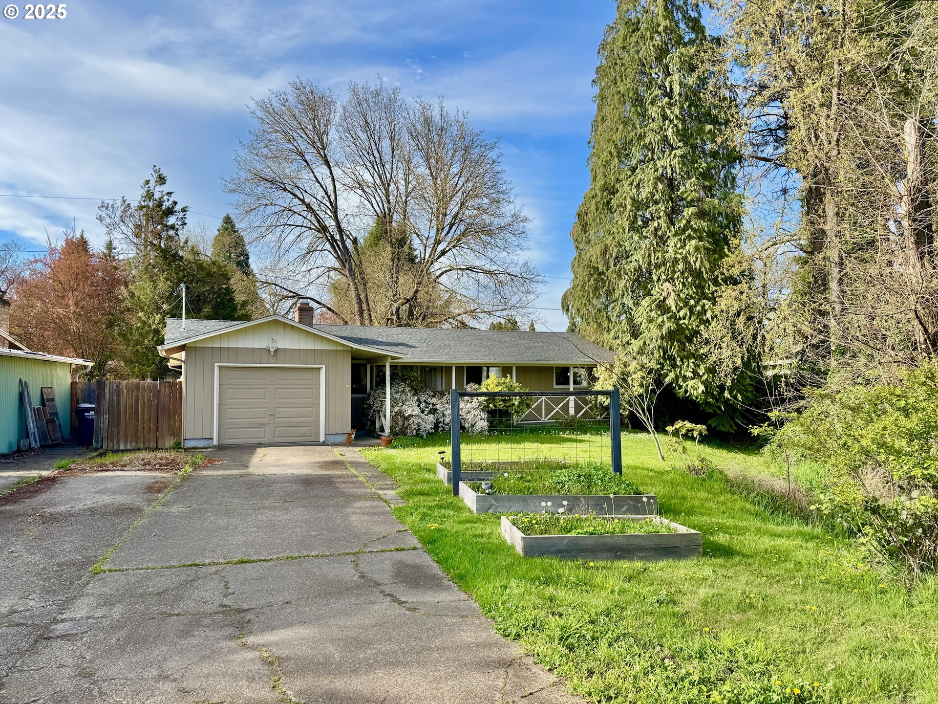 397 River Loop 2 Eugene, OR 97404 - Photo 42 of 42 a front view of a house with a yard and green space