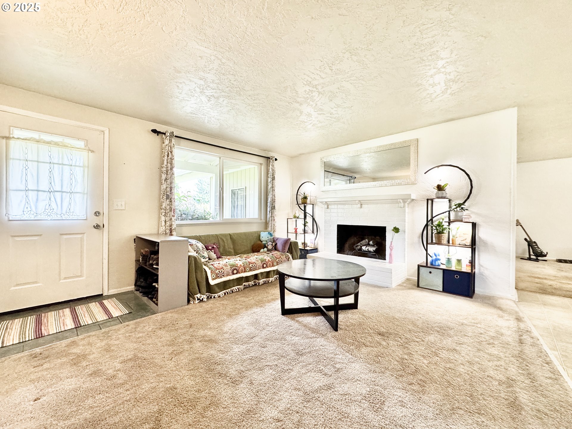 397 River Loop 2 Eugene, OR 97404 - Photo 6 of 42 a living room with furniture and a fireplace