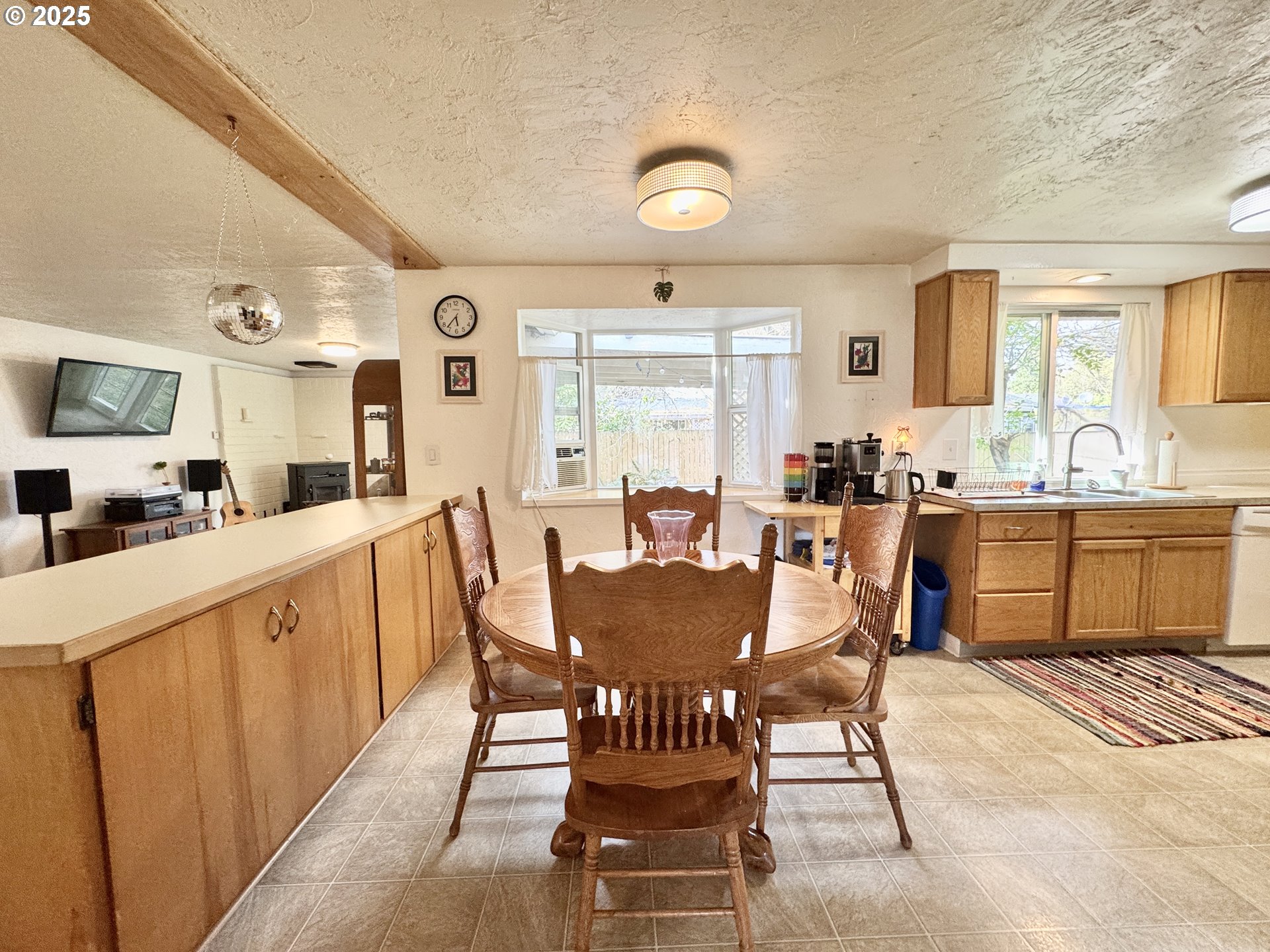 397 River Loop 2 Eugene, OR 97404 - Photo 9 of 42 a view of a dining room with furniture and window