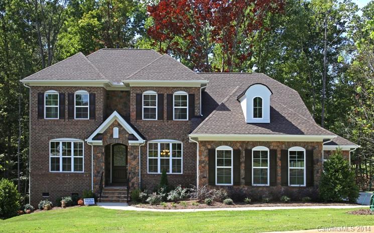 654 Chase Court, Unit 130 Fort Mill, SC 29708 - Photo 1 of 9 a front view of a house with a yard
