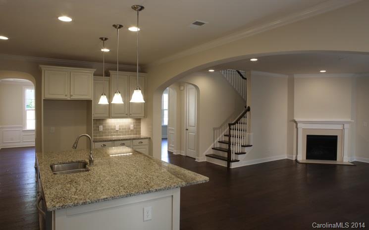 654 Chase Court, Unit 130 Fort Mill, SC 29708 - Photo 4 of 9 a room with lots of gym equipment and wooden floor