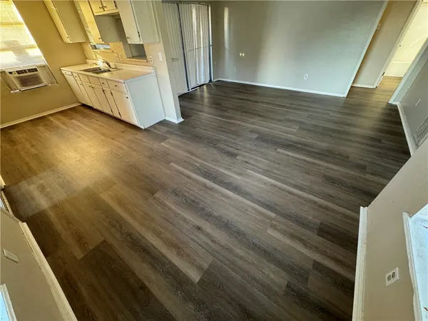 a view of a kitchen from an empty room