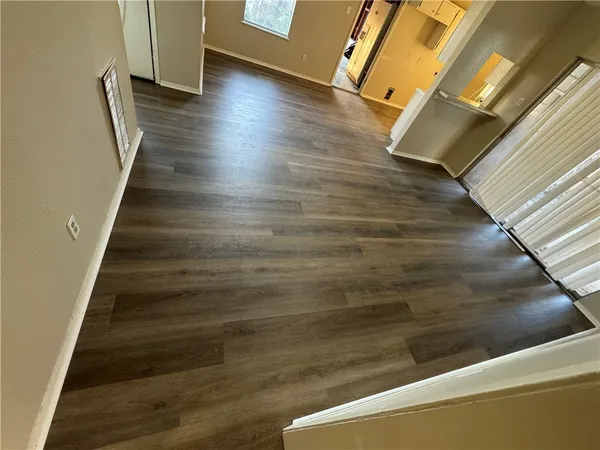 a view of balcony with wooden floor