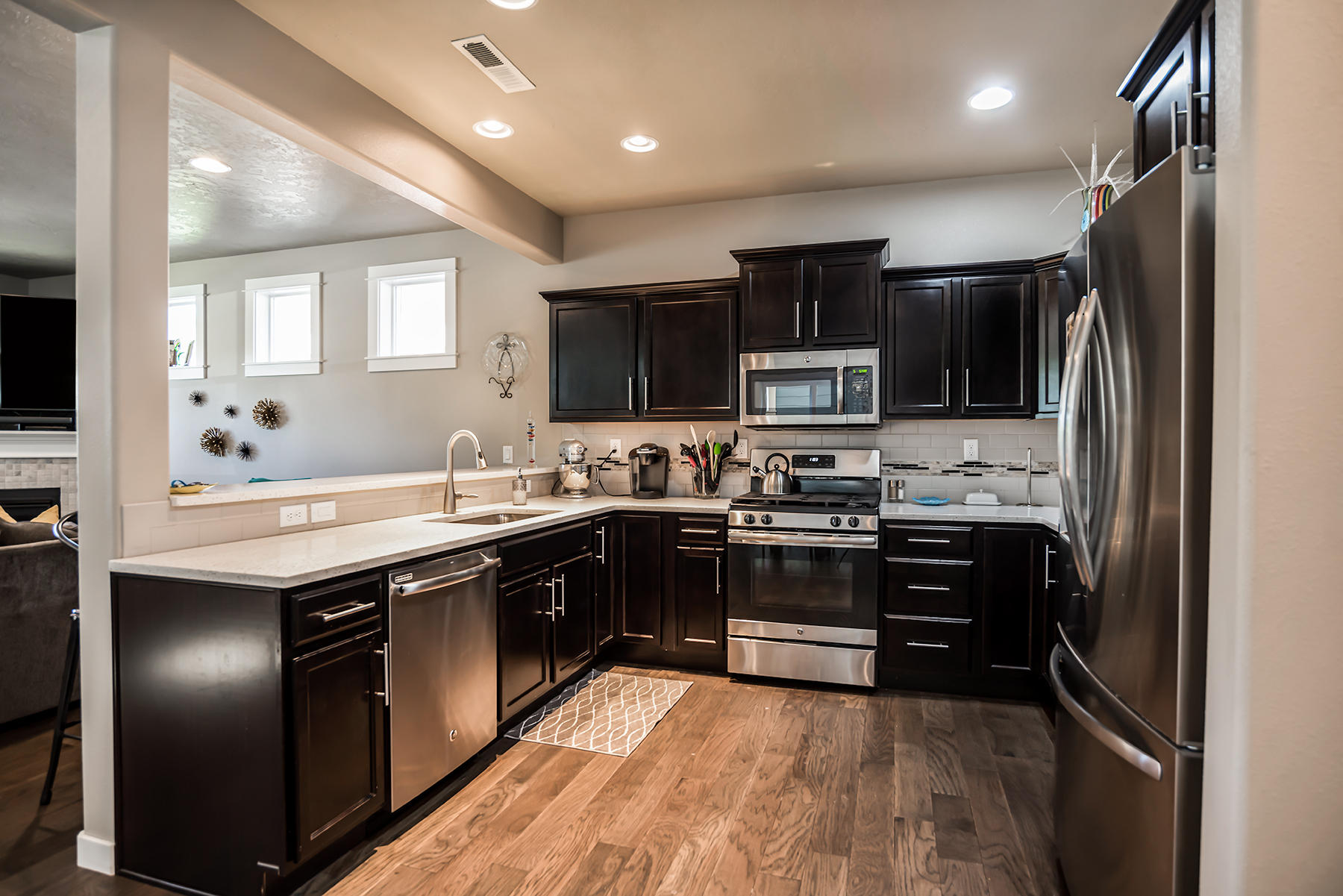 2546 Northwest Awbrey Road Bend, OR 97703 - Photo 9 of 22 a kitchen with stainless steel appliances granite countertop a stove refrigerator and microwave