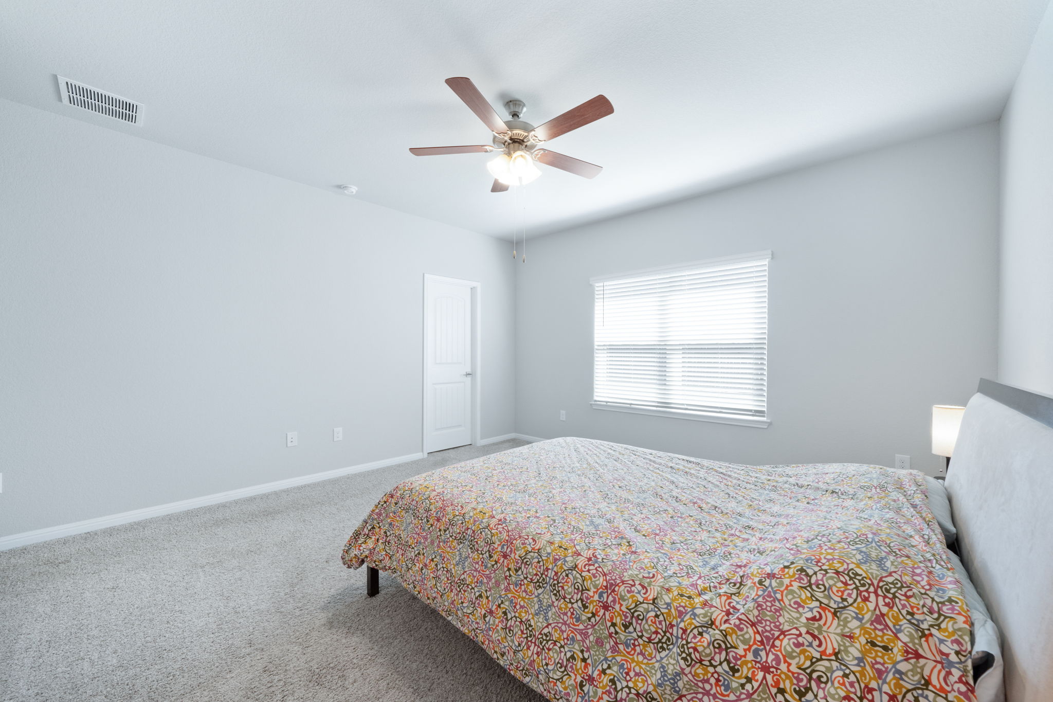 2412 Starhill Ranch Street Georgetown, TX 78628 - Photo 25 of 40 A well-proportioned bedroom with abundant natural illumination and a comfortable, tranquil ambiance.