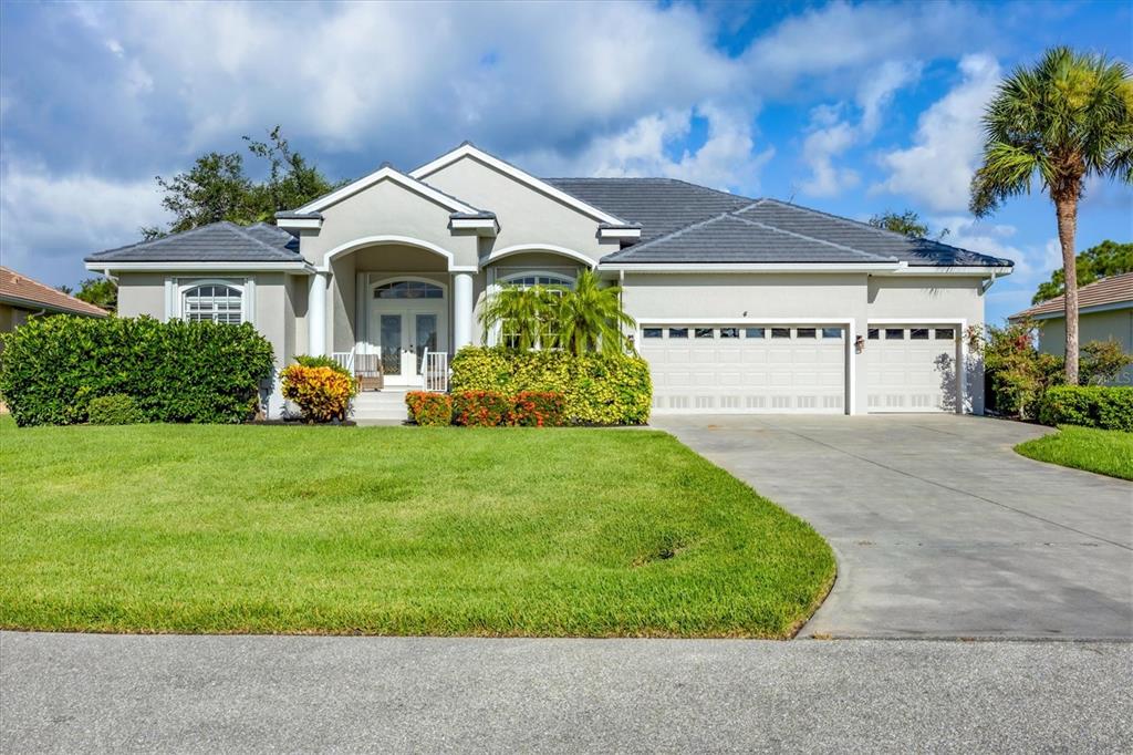 4 Windward Way Placida, FL 33946 - Photo 5 of 39 a front view of a house with garden