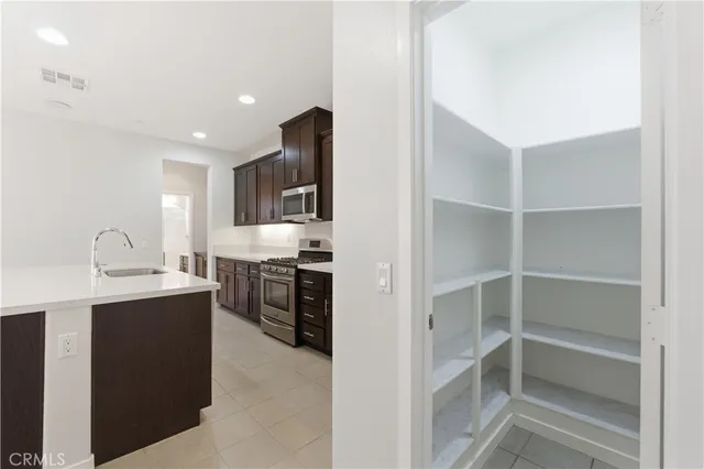 a kitchen with cabinets and window