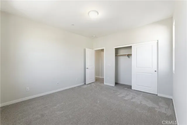 an empty room with closet area