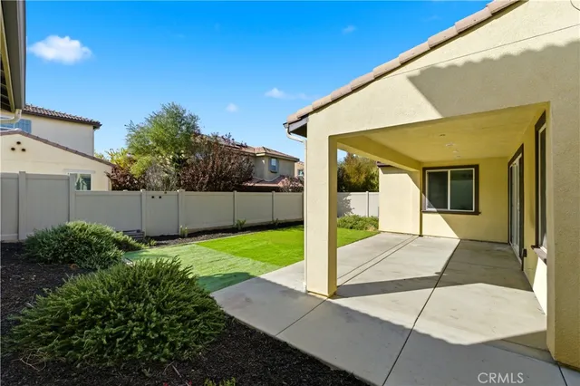 a view of a backyard of the house
