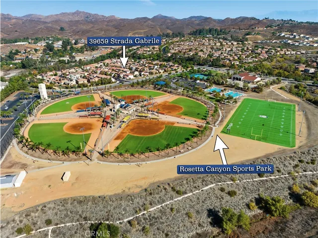 an aerial view of residential houses and outdoor space